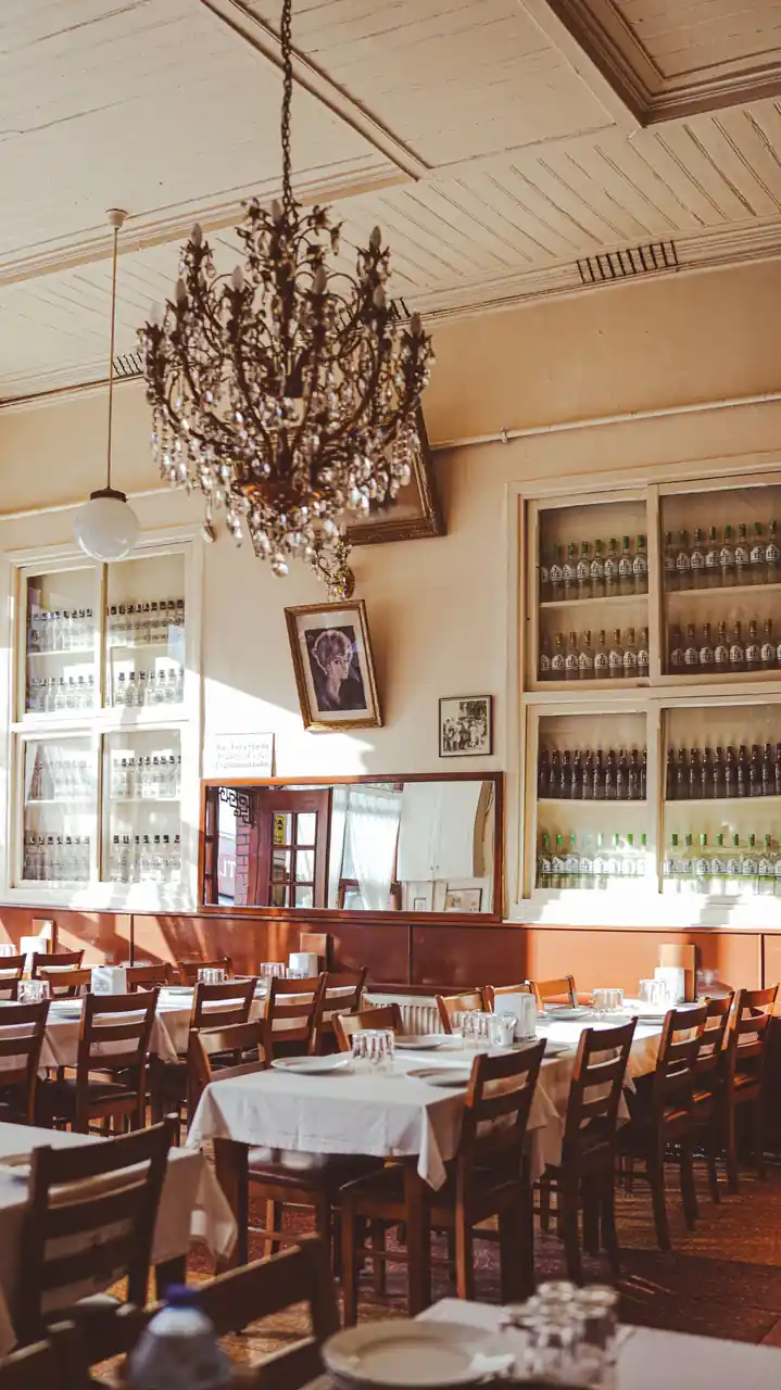 Classic table settings under warm chandeliers