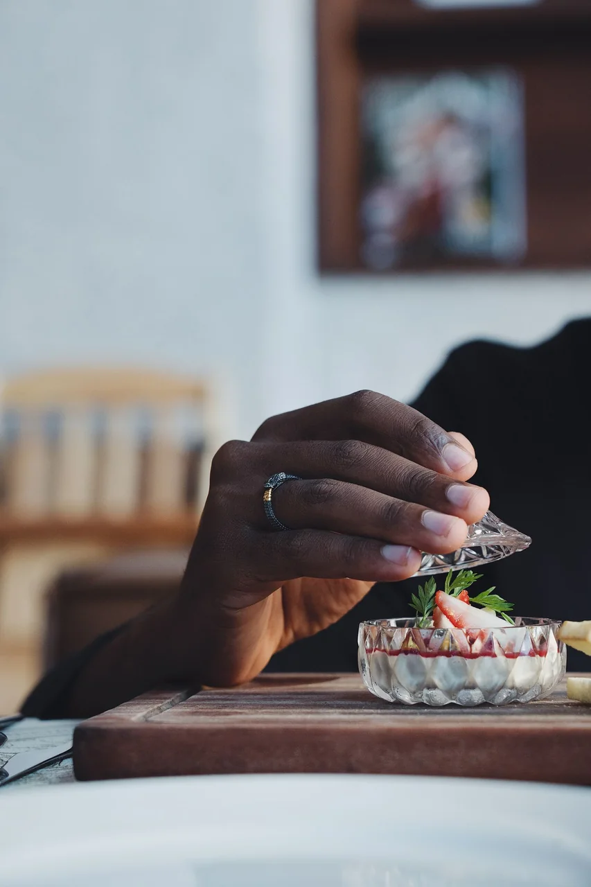 Chef garnishing a seasonal dish