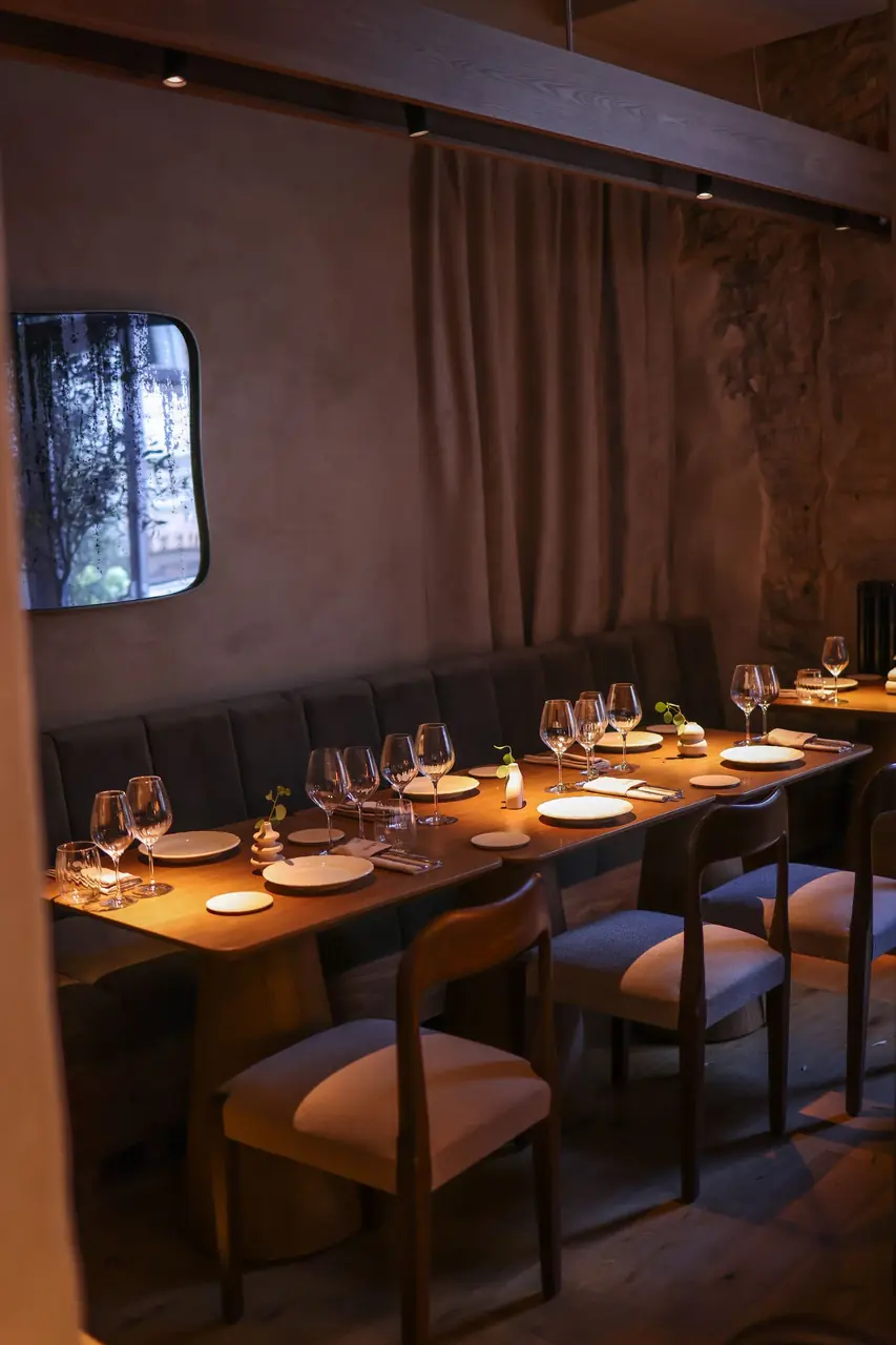 Luxurious dining room at Norvella Cuisine with elegant table settings and ambient evening light