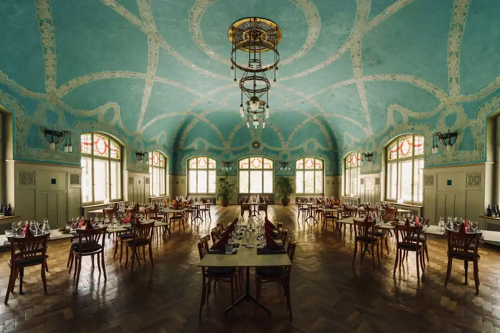 Sophisticated dining space with blue ornate ceiling